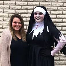 A customer dressed as a nun alongside a friend.